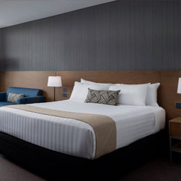 Rydges Camperdown - Plait Black Breakfast Cushions, and Max Putty Vogue Euro Runner on bed