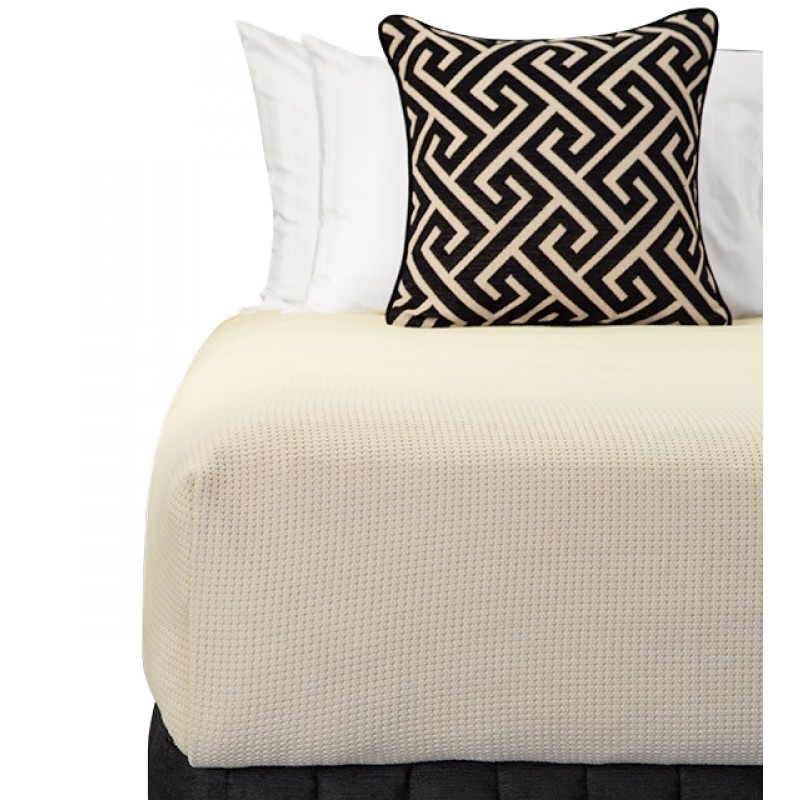 Bed Dressed with Carlo Blanket (Stone), Suite Valance (Siam Black), Large Decorative Cushion (Apollo Jet), Microball Resort Pillows with Corniche White Standard Pillowcases