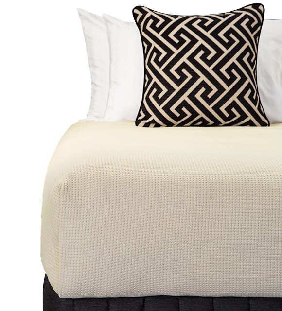 Bed Dressed with Carlo Blanket (Stone), Suite Valance (Siam Black), Large Decorative Cushion (Apollo Jet), Microball Resort Pillows with Corniche White Standard Pillowcases